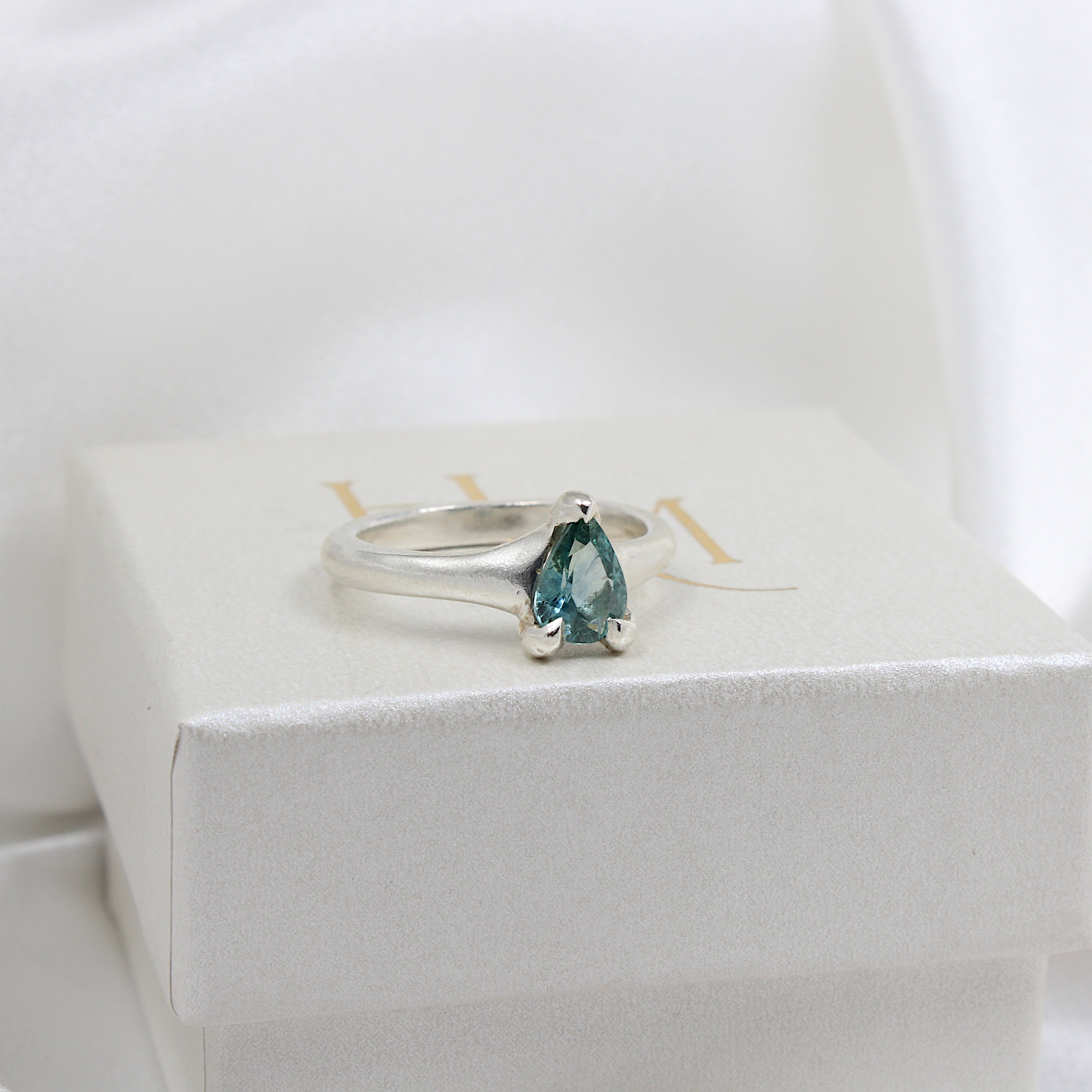 Blue sapphire ring | Hannah McDanielson Jewellery - sterling silver pear blue sapphire claw set ring